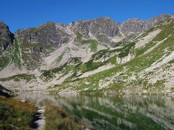 Obrazek przedstawia grafikę promocyjną wydarzenia Wycieczka w Tatry Wysokie: Wrota Chałubińskiego i Morskie Oko